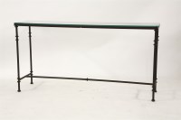 Lot 594 - A contemporary tubular iron and glass topped console table