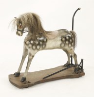 Lot 480 - An early Victorian push along rocking horse