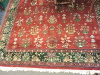 Lot 602 - A burgundy ground carpet