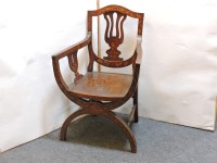 Lot 597 - A Dutch marquetry 'X' frame elbow chair