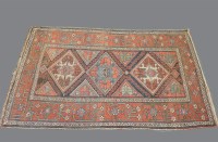 Lot 709A - A red ground rug