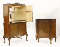 Lot 551 - A walnut cocktail cupboard