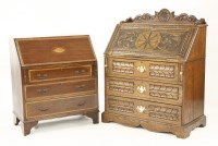 Lot 555 - A carved oak bureau