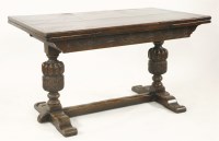 Lot 710 - An oak drawer leaf table