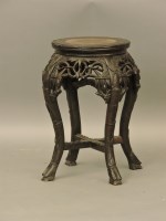 Lot 695 - A Chinese hardwood vase stand