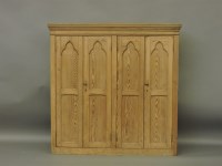 Lot 668 - A large pine Gothic style hanging wall cabinet