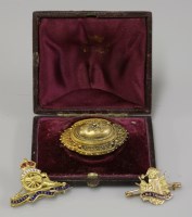 Lot 20 - A Victorian gold Etruscan revival shield brooch