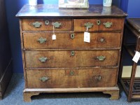 Lot 774 - A 19th century walnut chest of two short and three long drawers