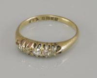 Lot 97 - An 18ct gold five stone diamond ring