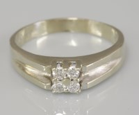 Lot 27 - A white gold four stone diamond cluster ring
