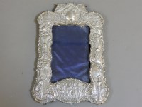 Lot 297 - A silver repoussé decorated photograph frame