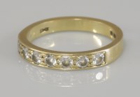 Lot 90 - An 18ct gold diamond half eternity ring