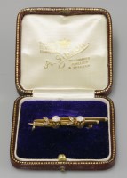 Lot 41 - A cased gold opal and diamond bar brooch