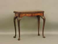 Lot 744 - A reproduction walnut card table