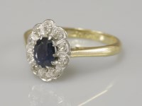 Lot 50 - A sapphire and diamond cluster ring