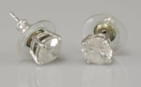 Lot 99 - A pair of diamond single stone stud earrings