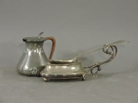 Lot 304 - An Art Nouveau pewter jug