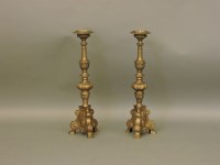 Lot 507 - A pair of 17th century style brass pricket candlesticks