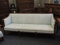 Lot 707 - A Regency style sofa in blue swirl fabric on four front fluted supports