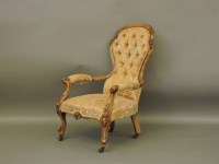 Lot 749 - A Victorian walnut moulded frame spoon and button back armchair