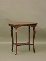 Lot 765 - An oval two tiered table