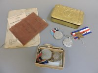 Lot 260 - A Queen Mary tin containing WW1 and WW11 service medals