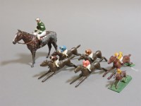 Lot 267 - Four lead 'Escalado' racing game horses with jockeys