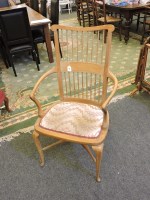 Lot 715 - A beech spindle backed open armchair