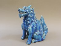 Lot 583 - A Chinese stoneware and blue glazed kylin