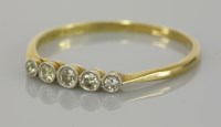 Lot 96 - A graduated 18ct gold and platinum five stone diamond ring