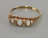 Lot 105 - An Edwardian 9ct rose gold opal ring