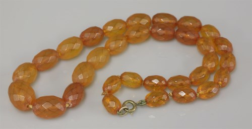 Lot 5 - A graduated amber faceted olive bead necklace