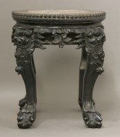 Lot 436 - A carved blackwood vase stand