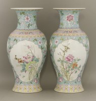 Lot 480 - A pair of pastel famille rose vases