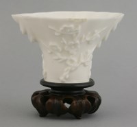 Lot 484 - A blanc de Chine 'rhinoceros horn' libation cup