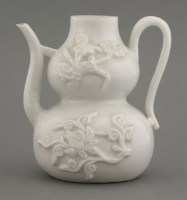 Lot 64 - A small blanc de Chine double gourd Ewer