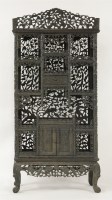 Lot 393 - A profusely carved blackwood Display Cabinet