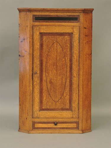 Lot 603 - A 19th century strung and inlaid oak hanging corner cabinet
