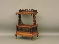 Lot 590 - A Victorian walnut Canterbury