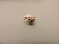 Lot 24 - A gold sapphire and rose cut diamond cluster ring