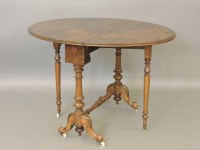 Lot 596 - A Victorian walnut Sutherland table