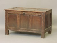 Lot 582 - An early 18th century oak three panelled coffer