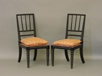 Lot 604 - A pair of late 19th century bobbin turned ebonised chairs