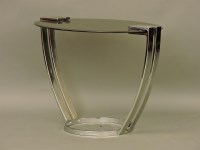 Lot 541 - A glass and chrome table