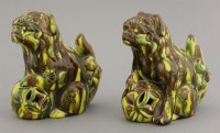 Lot 209 - A pair of earthenware sancai Buddhist lions