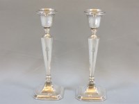 Lot 176 - A pair of silver candlesticks