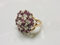 Lot 5 - A 9ct gold illusion set diamond and ruby cluster ring