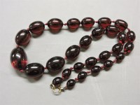 Lot 77 - A single row graduated olive shaped bakelite bead necklace