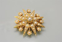 Lot 7 - A 9ct gold reproduction cultured pearl star burst brooch