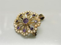 Lot 33 - An Edwardian amethyst and split pearl brooch pendant
